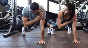 Fitness trainer demonstrating arm toning exercises Basingstoke 