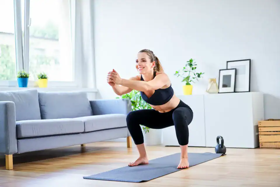 Woman doing bodyweight exercises Basingstoke  at home