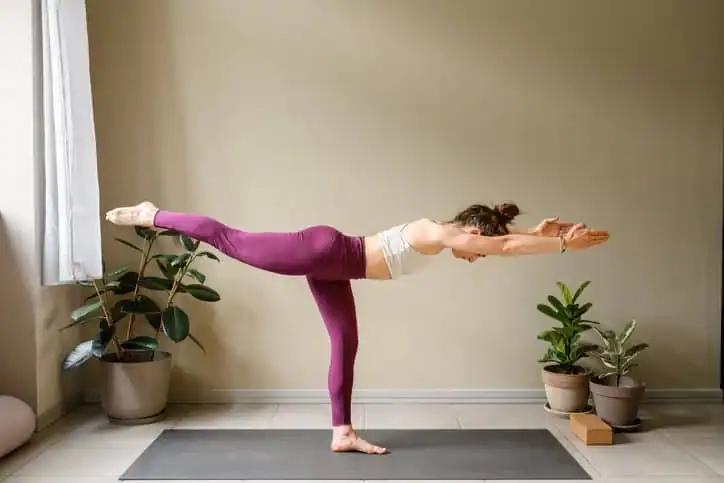 Woman doing Yoga exercise Basingstoke  to help with toning the body. 