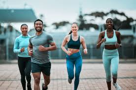 image of people running to incorporate cardio Basingstoke  exercise into their life to help tone arms and body.